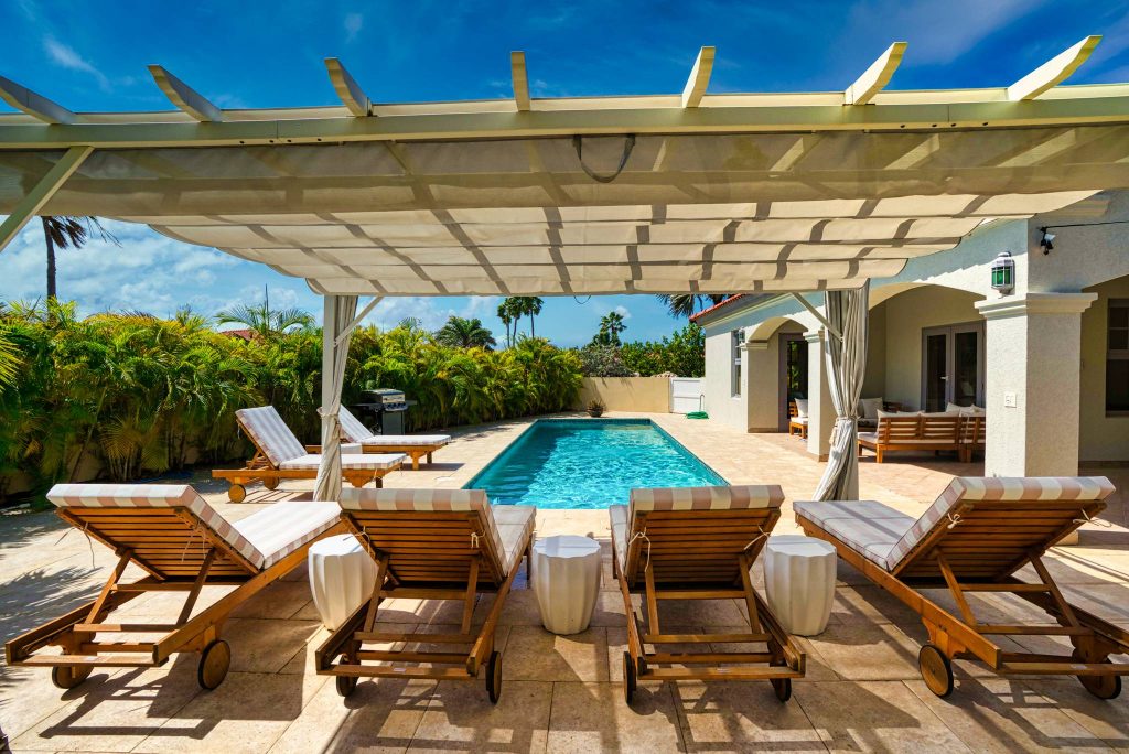 Poolside at one of our Tierra Del Sol Aruba vacation home rentals.