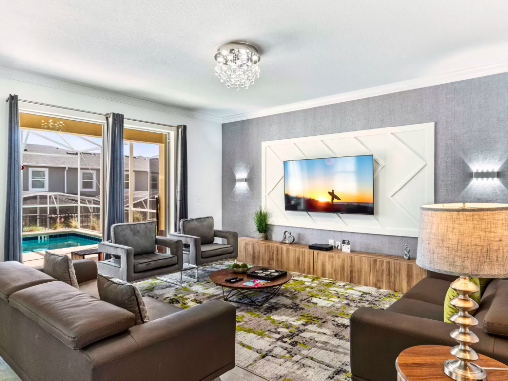 living room with a tv in one of our vacation rentals in Orlando Florida area