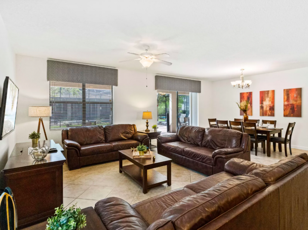 living room with leather seats at one of our Champions Gate Rentals VRBO