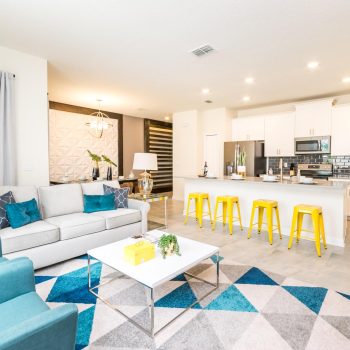 View of luxury living room with open kitchen at casiola rentals in Orlando Florida