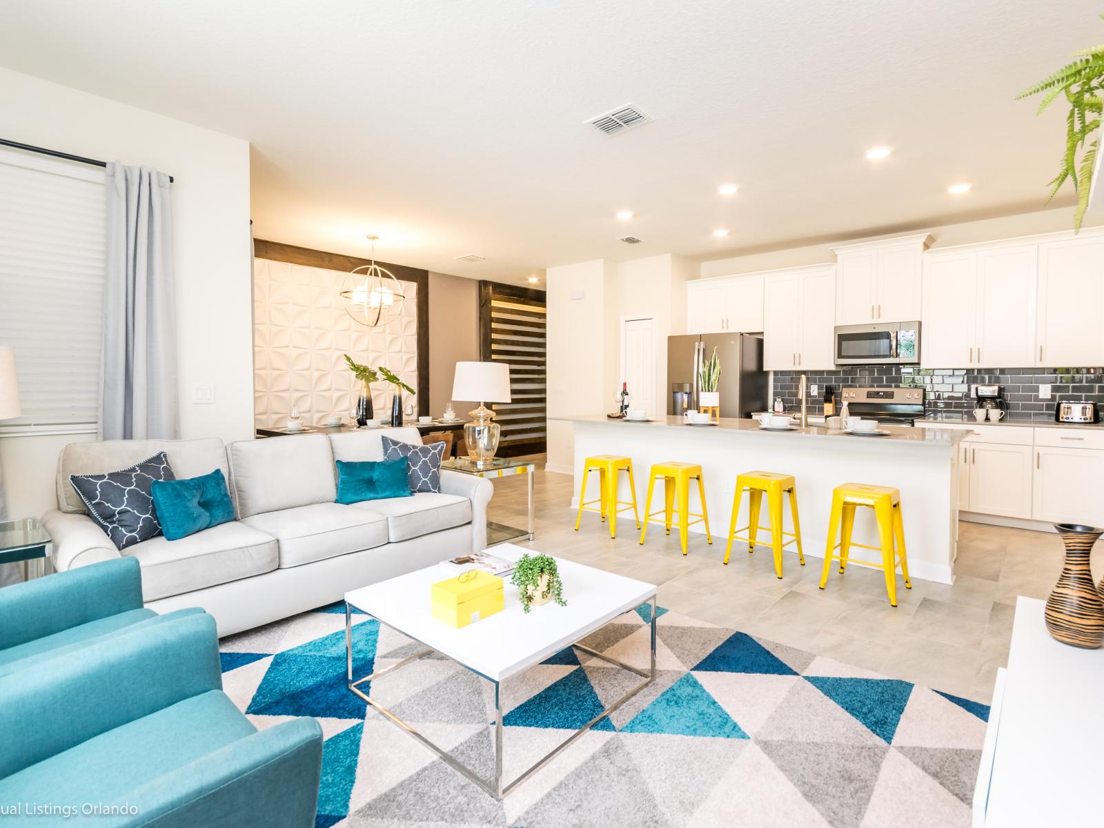 View of luxury living room with open kitchen at casiola rentals in Orlando Florida