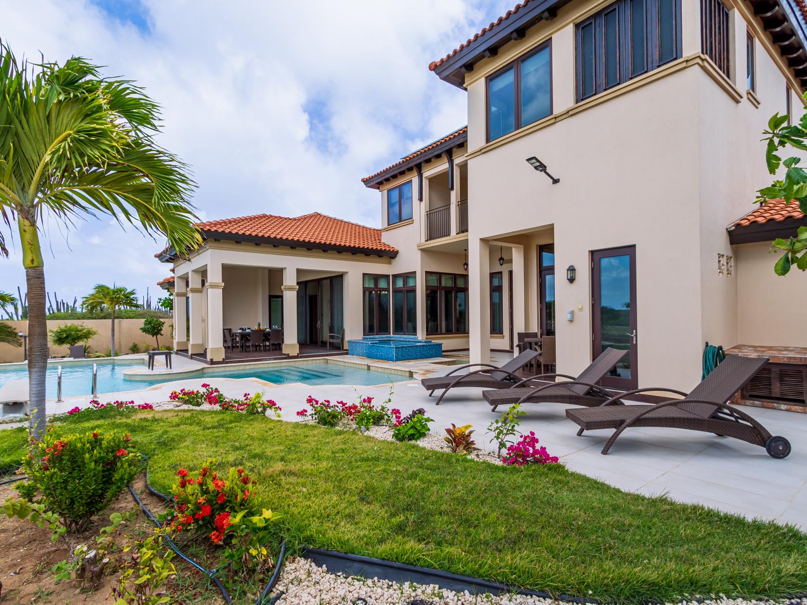 Aruba vacation rental with a beautiful backyard oasis with a pool